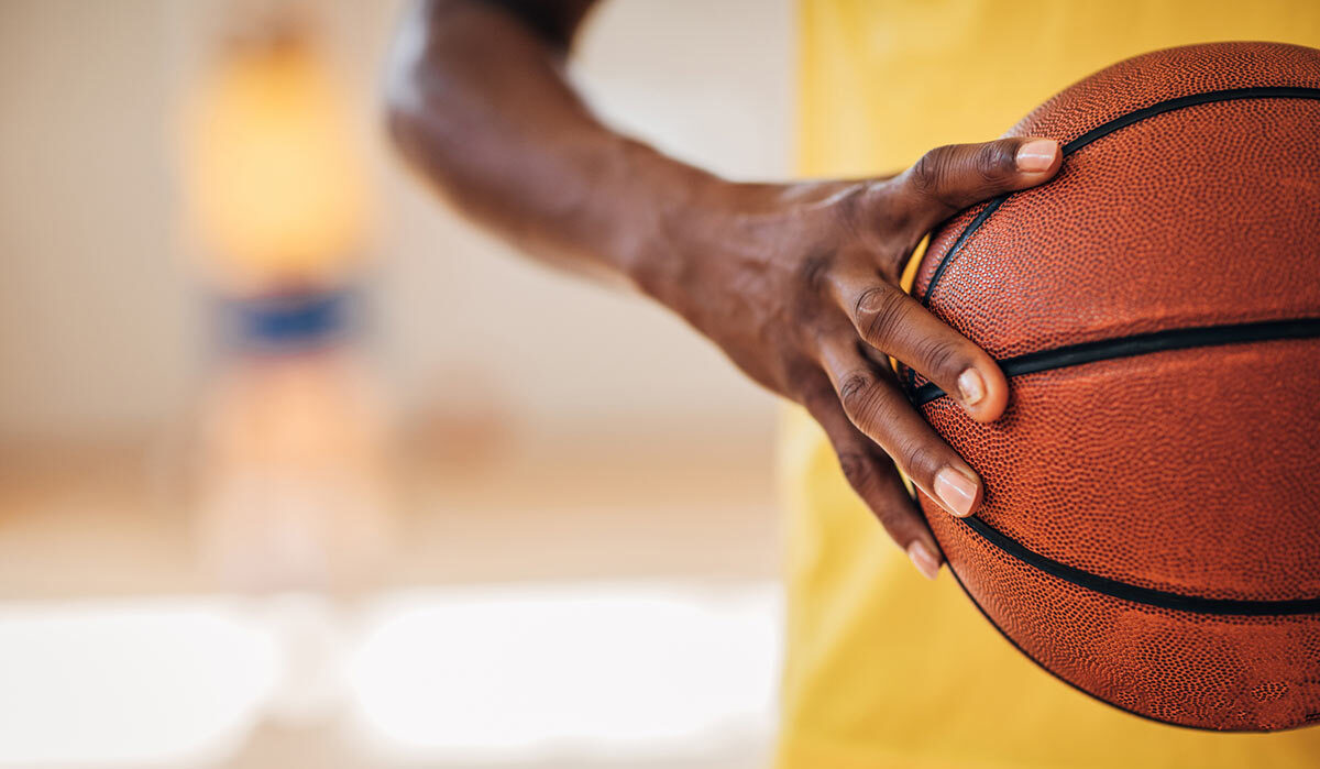 basketball player holding basketball